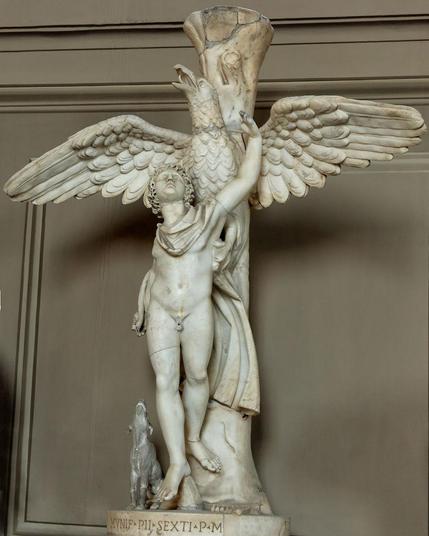 Roman marble sculpture of Ganymedes and Zeus in the shape of an eagle who has his talons around the youth's body. Ganymedes reaches up towards the eagle. A hound watches the scene.