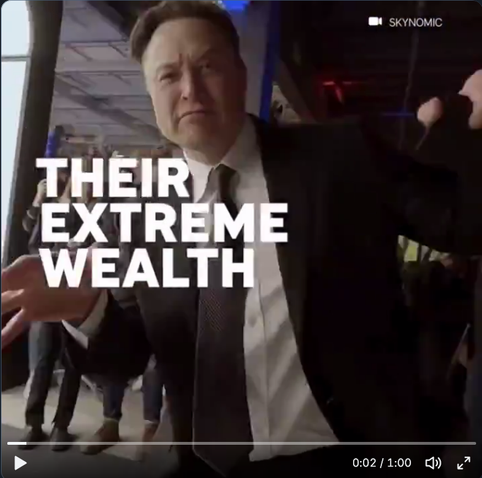 Elon Musk saltando con mirada desafiante hacia la camara