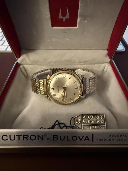 Photo of a 1969 era Bulova Accutron wrist watch in its original case.