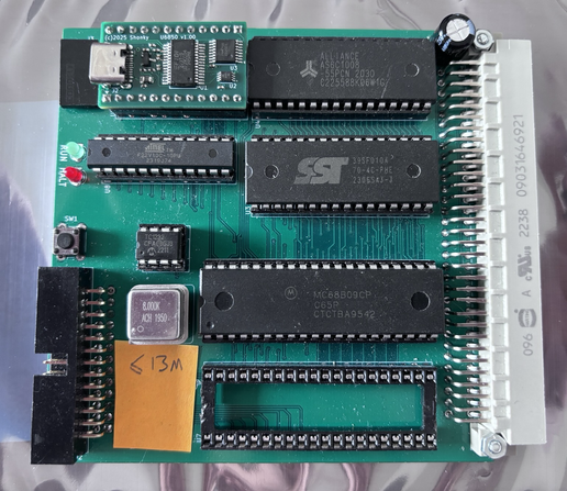 A single board computer based around a 6809 microprocessor, and with the 6850 serial port replaced by a custom PCB allowing a direct USB connection