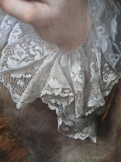 The lace cuff on a fur-trimmed jacket on this 18th century portrait. It has a lot of gathers so it wrinkles the lace, but the wrinkles are perfectly captured. But the detail on the lace is phenomenal. It has floral motifs and different kinds of background (we call just ground in lace) and it has these amazing spider motifs that you could definitely re-create from this painting. The quality of the lace in this painting floored me. 