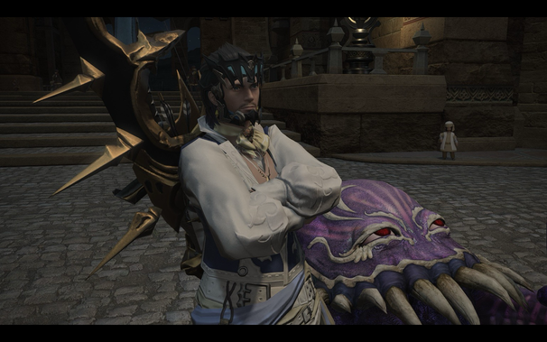 A male character from a fantasy video game, possibly Final Fantasy XIV, poses confidently with his arms crossed. He wears ornate, dark headgear and a white puffy-sleeved shirt with blue accents. Behind him is a large, purple, monster-like creature with sharp teeth and red eyes. In the blurred background, a child-sized character stands on a stone pathway. The scene is set in dimly lit stone surroundings.  