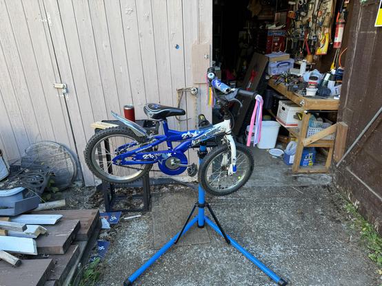 Kid’s bime up on a repair stand.