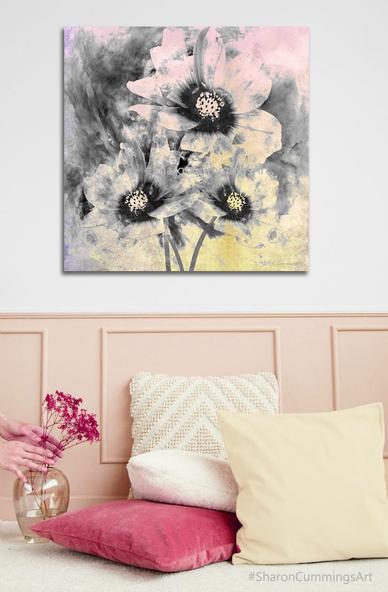Soft pink and yellow over black and white cosmos flowers in a furniture setting with pillows and a vase with flowers by artist Sharon Cummings.