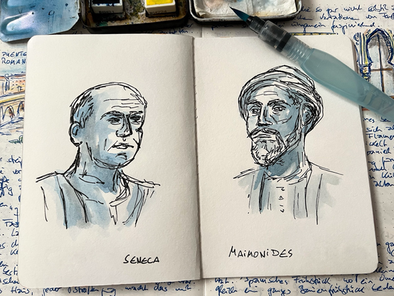 Open sketchbook with portrait drawings of Seneca (left) and Maimonides (right), in ink and discreetly watercoloured blue-grey. A water brush and a watercolour box at the upper edge of the picture, with an open diary below.