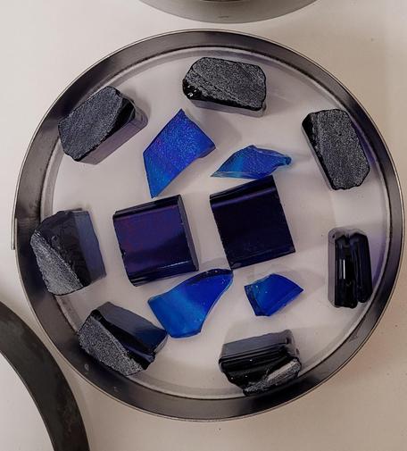 The pattern bars from the last photo were cut into 1 inch chunks and placed in a 6 inch circular mold.  They'll be fired into a plate.  There are 4 chunks from the puddle-smashed-into-pieces from the last post that are in there as well.