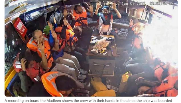 Madleen crew hands up