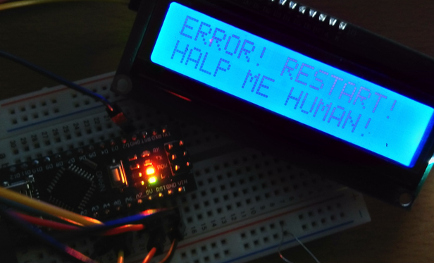 **TL;DR:** The AirMaster3000 shows an error message asking for a restart and human help, humorously suggesting it's in distress.

**Extracted Text:**
**ERROR! RESTART!
HALP ME HUMAN!**

**Description:**
A close-up of the AirMaster3000 CO₂ sensor project shows an Arduino Nano on a breadboard, lit with red, yellow, and green LEDs. The connected LCD screen glows bright blue and displays a humorous error message in large block letters: “ERROR! RESTART! HALP ME HUMAN!” suggesting a malfunction. The message adds a playful, anthropomorphic tone to the technical issue, mimicking a cry for help from the device.
