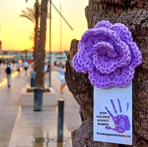 a kitted purple rose, stop violence against women, in brindisi, italy