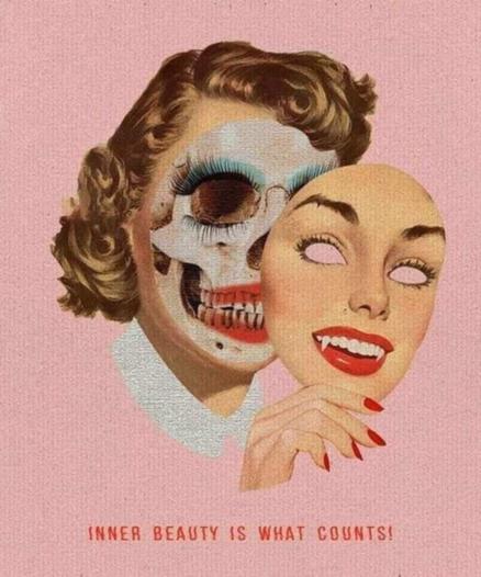 Inner Beauty Is What Counts

a woman taking off her face and you see the skull with makeup on still behind her mask, which for some reason has fangs