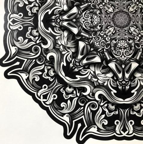 Close-up section of a black on white vector mandala that has been printed and coloured in or shaded using varying grades of pencil. Many varying symmetrical organic and floral ornaments rotate in patterned sections emanating outwards around an eight fold axis.