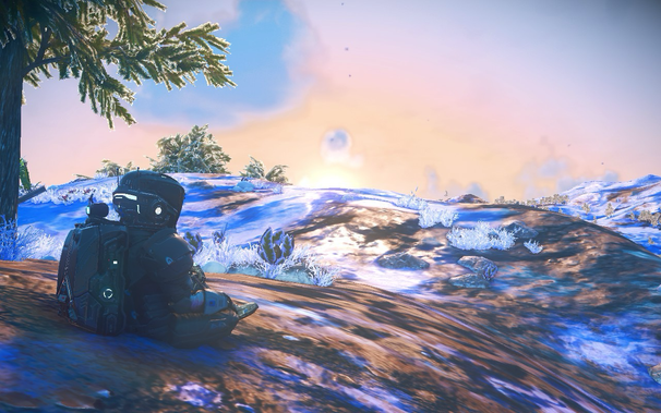 A person in a futuristic spacesuit sits on a snowy terrain, facing a scenic sunrise or sunset. The landscape features snow-covered ground, sparse vegetation, and distant hills. The sky is a blend of soft pastel colors, with a prominent sun and scattered clouds. A tree with green foliage is visible on the left side of the image.