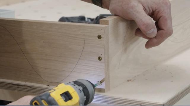 Door jamb assembly adding three screws to attach pieces of oak together. Video screenshot.