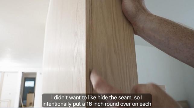 Corer where two pieces of oak butt into each other. Video screenshot with the caption "I didn't want to like hide the seam, so I intentionally but a 16th inch round over on each"