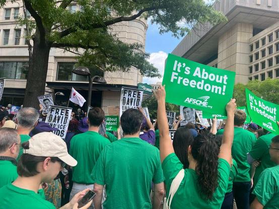 Photograph 
AFSCME union members in green shirts assemble calling for Freedom for David Huerta hold signs eg “it’s About Freedom” 

Source AFSCME 
https://www.afscme.org/blog/release-our-union-brother-now