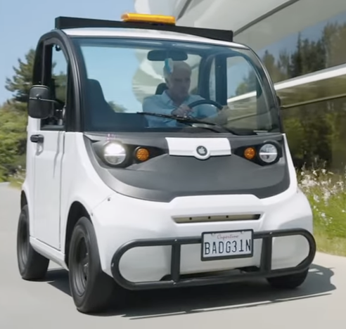 Screenshot of the keynote today, with Federighi in a security golf cart thing, with the Cupertino (?) plate “BADG31N”