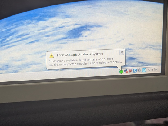 WIndows XP screen with an error message: "16802 Logic Analysis System" "Instrument available--but it contains one or more invalid/unsupported modules! Check instrument details."