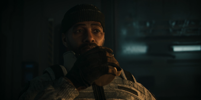 A imagem apresenta o personagem Nik Hanson do episódio Exodus: Odyssey de Secret Level. Ele está vestido com um traje escuro tático, com detalhes metálicos e uma gola alta. Seu rosto é parcialmente sombreado, destacando seus olhos expressivos e um olhar determinado. A iluminação da cena é contrastante, com tons frios no fundo e luz quente iluminando parte do personagem, criando um efeito dramático. O fundo é abstrato, sem elementos visíveis que distraiam do foco principal da imagem.