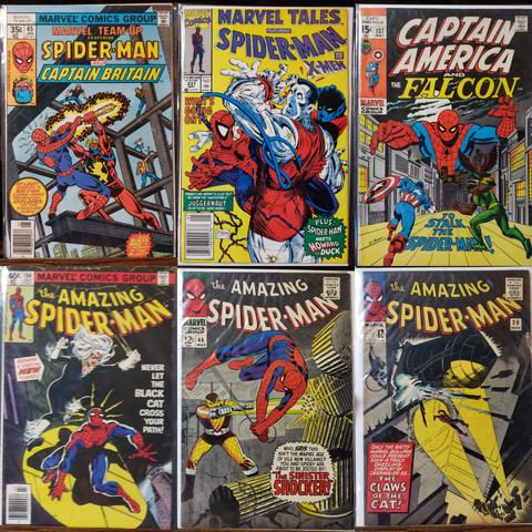 A photo collage of 6 comic books featuring Spider-Man.

Marvel Team-Up 65 featuring Spider-Man and Captain Britain. At last! Marvel's British Super-Hero Sensation Explodes on the Stateside Scene--and Guess Who Is Caught in the Blast? Cover features Spidey vs Cap B in a high-rise construction site fight.

Marvel Tales 237 featuring Spider-Man and the X-Men. What's Going On?! Frankly, we haven't a clue! But we know the "unstoppable" Juggernaut is up to no-good again! Plus: Spider-Man meets Howard the Duck. McFarlane cover has Spidey in close quarters with Colossus and Nightcrawler. 

Captain America (and The Falcon) 137 To Stalk A Spider-Man! Sal Buscema cover is an image of Spidey looming over city streets with Cap & Falcon on the hunt. 

Amazing Spider-Man 194 featuring a Startling New Villainess! Never Let The Black Cat Cross Your Path! Spidey gets pounced on the side of a building in this blurry photo of the cover. 

Amazing Spider-Man 46 Who says this isn't the Marvel Age of Vile New Villains? You and Spidey are about to be Jolted by: "The Sinister Shocker!" Our hero evades a jolt that takes down a limestone column.

Amazing Spider-Man 30 Only the Batty Marvel Bullpen could present such a truly Dazzling Display of Derring-Do as... "The Claws of The Cat!" Police spotlights from the street illuminate a rooftop water-tower being toppled onto Spidey by a hidden assailant.
