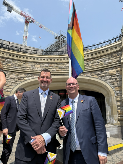 Senators Wilson and Wells at Pride flag raising on Parliament Hill. 
