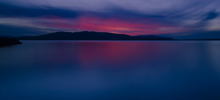 The last sunset of 2023 has some pink hues to mix with the blue hour. 