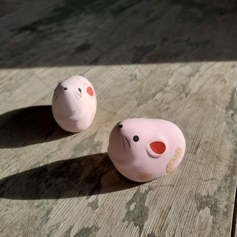 Colourful clay mice hold fortune slips within.