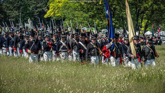 Americans marching through a field