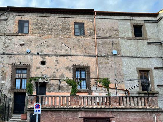 Facade of the residence for sale at Orsini Castle. A rare synthesis of historical significance, refined elegance, and practical connectivity (including nearby parking). It is an invitation to assume custodianship of a living legacy, meticulously adapted for modern discerning living