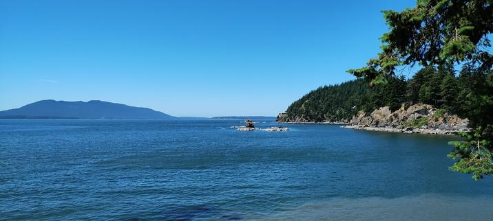 Photo of Larrabee State Park overlooking the bay, some land mass and trees on the right side to add some depth