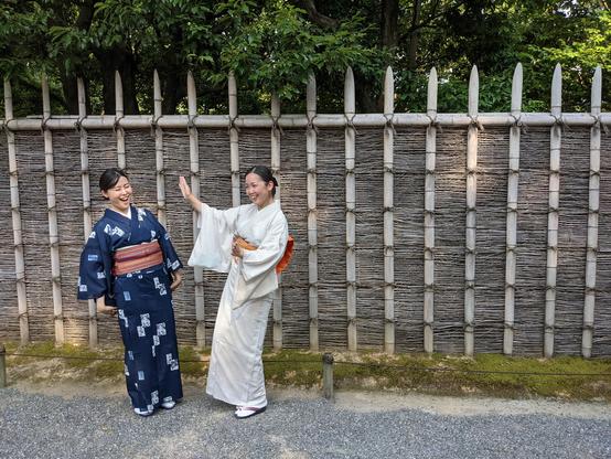 Nao-san and Atsuko-san wait to enter Katsura Rikyu by the palace's distinctive fence.