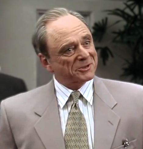 Photo of Harris Yulin, a middle aged white man in a suit and tie.