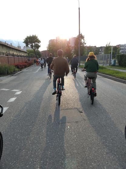 People cycling at the sunset