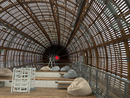 Latticework interior of wooden airship showing turbines