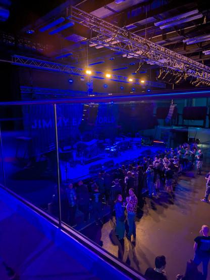 View from a balcony seat above a standing only gig