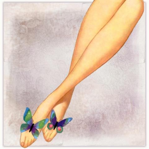A woman's legs with butterflies on her feet.