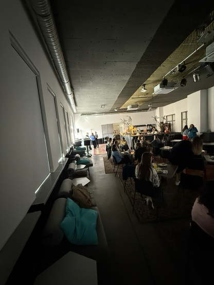 Dark Coffee interior with people sitting at tables