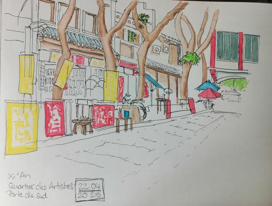Une rue arborée avec ses boutiques de matériel d'art et ses dévantures en rouge et jaune impérial typique à Xi'an Chine.
A chinese tree lined street with small art supply shops and it's typical red and yellow shop signs.