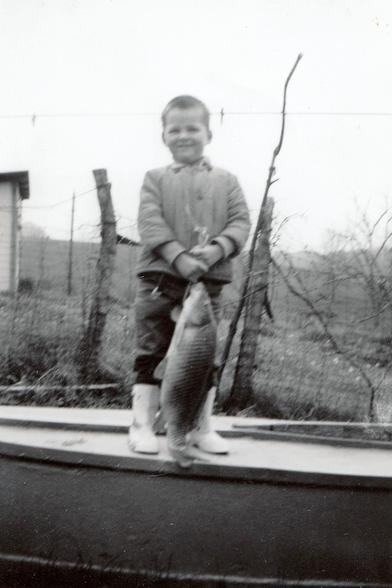 A blurry picture of me at age 5 with a 5 lb dogfish that I caught