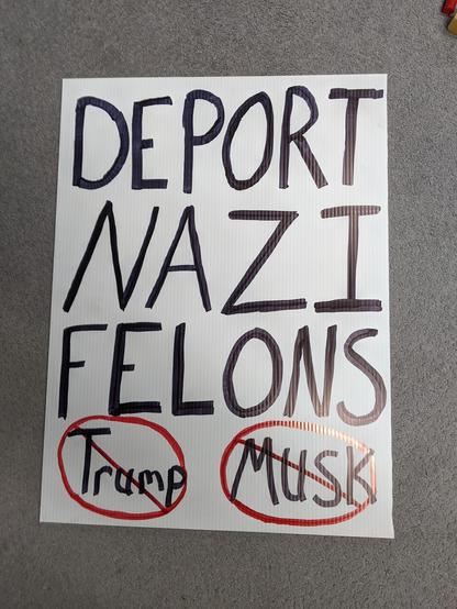 Other side of the protest sign that reads Deport Nazi Felons with trump and musk crossed out at the bottom.