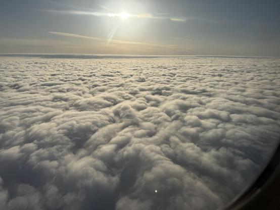Sunny view flying into Seattle, before descending through the cloud layer.