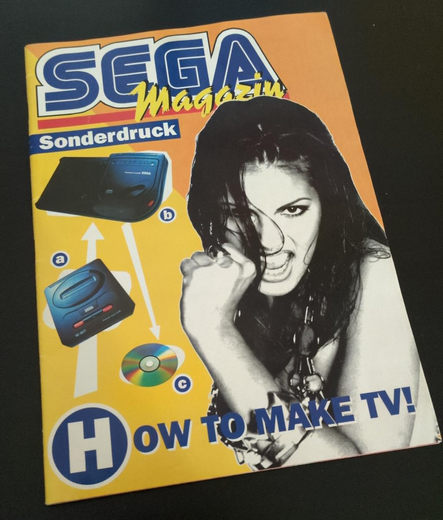 Front cover of Sega Magazin, showing a Mega Drive II, a Mega CD II and a woman.