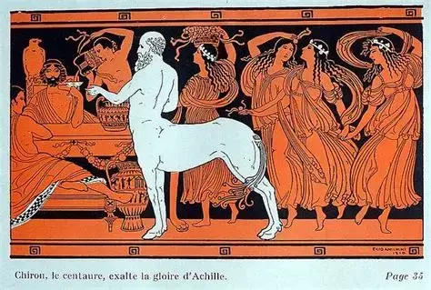 A drawing in the style of red figure vase paintings showing the centaur Chiron in white as an elderly person with a beard and baldness. The caption says he is attending a gathering celebrating the glory of Achilles. Four women are dancing beside him, a young man is pouring wine, and two men are sitting at a table.
