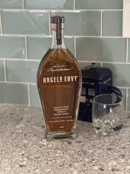 Bottle of bourbon and a cocktail glass
