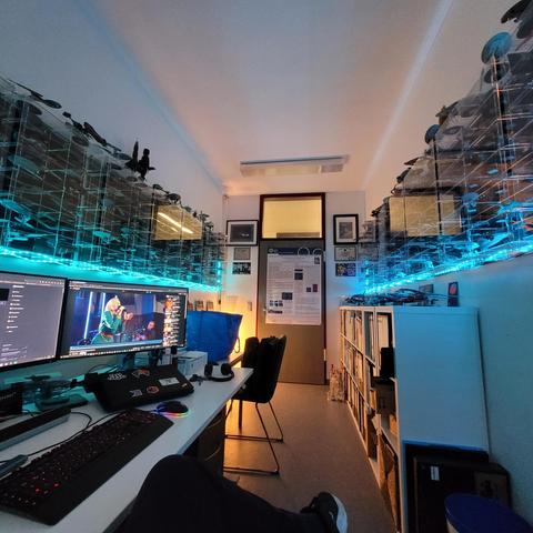 Buro with starships in shelves highlited with maritime green LED