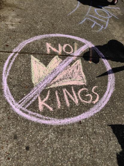A crude image of a crown with a purple "cancelled" sign. Words can be seen to read "No Kings."