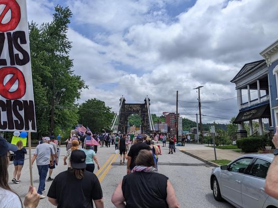 Photo of the marchers heading to the suspension bridge.