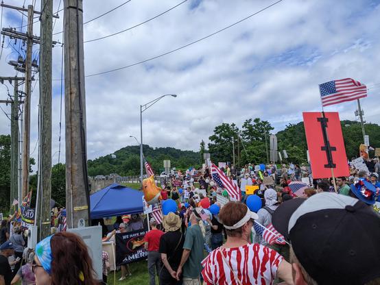 Beginning of the local march with lots of folks with signs & flags.
