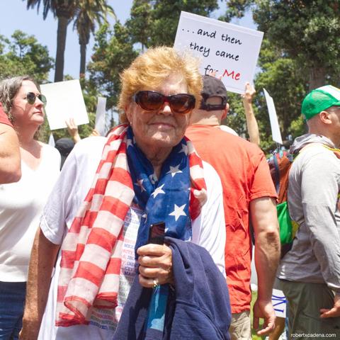 A woman wearing an American flag scarf