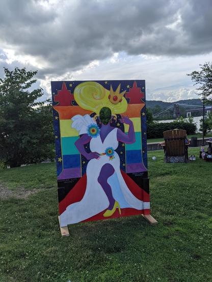 Photo of a wooden painted cutout sign of a fabulous drag queen.