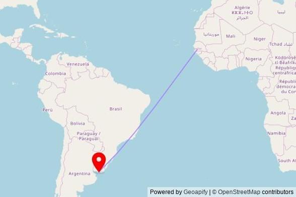 A map showing the great circle route from Soma in Gambia to a map pin at Capilla Nuestra Señora del Carmen, Camino de la Ermita 8831, 15700 Montevideo, Uruguay